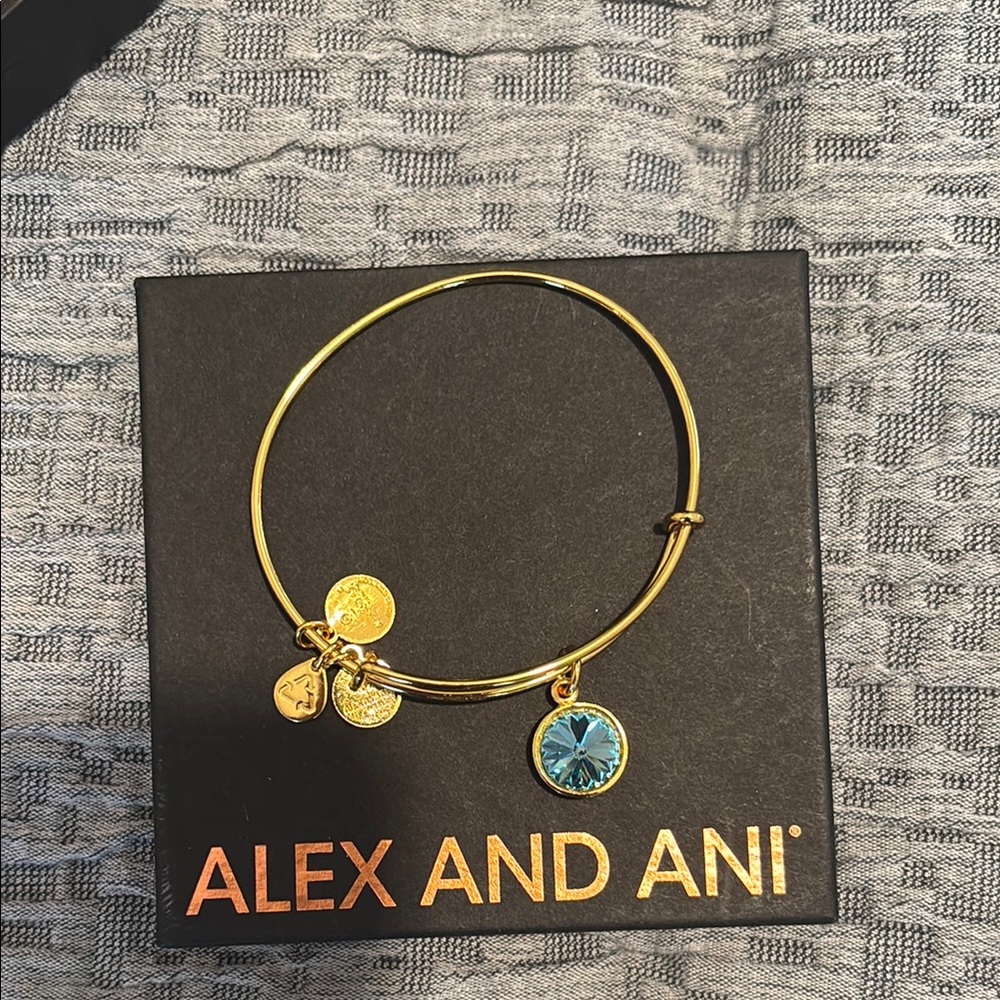 Alex and Ani Gold Bangle Bracelet with Blue Charm